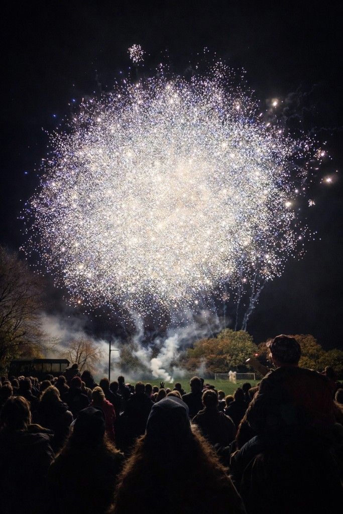 Crowds enjoying school fireworks display