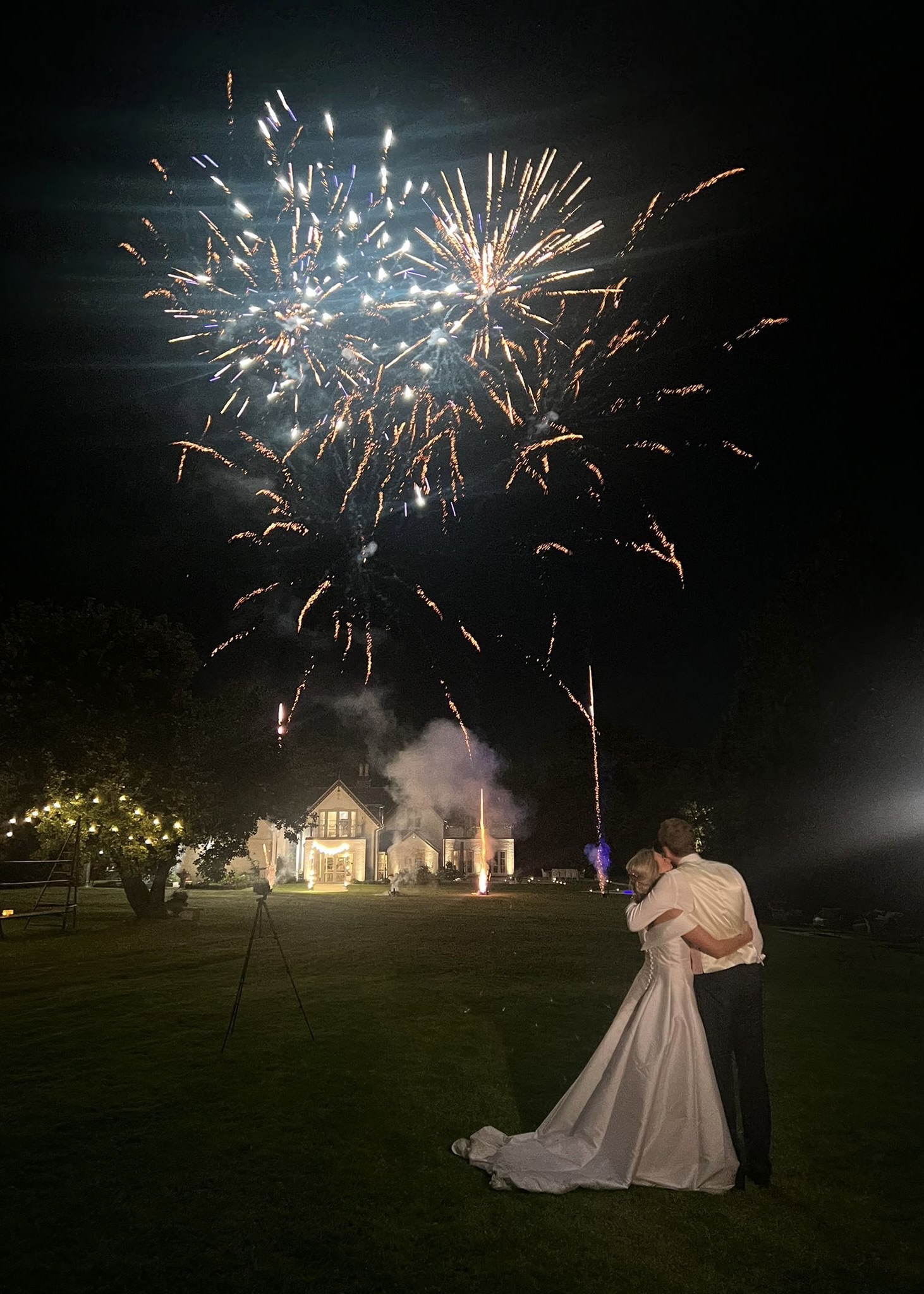 IMG_6714 Wedding couple standing as golden fireworks light the sky